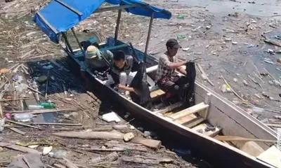 nagaland  villagers take initiative to clean doyang reservoir of floating debris