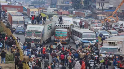 assam  massive protest by truckers over new hit and run law in karimganj