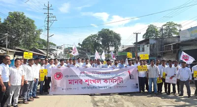 assam  aasu stages human chain protest over poor road conditions in tinsukia