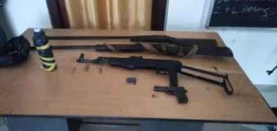 assam  police seize arms cache  detain three in diphu