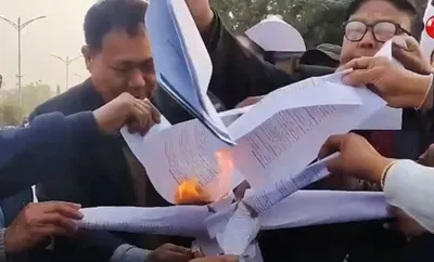 manipur  protesters burn union budget 2025 copies in imphal